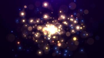 Abstract explosion of glitter particles creating a fireworks display of beautiful bokeh. Glitter and shimmer loop design video