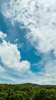 Beautiful summer day sky with fluffy white clouds time lapse in bright blue atmosphere. video