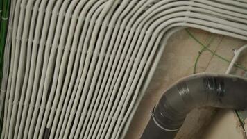 Electrical conduit and ventilation pipe on concrete ceiling video