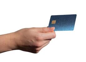 Bank card held in hand, showcasing a shiny blue plastic design with a chip. Customer using the card photo