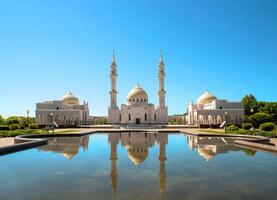 A White Mosque with a reflection on a sunny summer day. Muslim Shrine, an architectural complex in Bolgar, Republic of Tatarstan photo