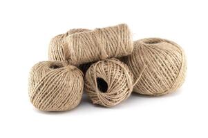 A cluster of twine balls in various sizes, showcasing natural fibers and earthy textures. photo