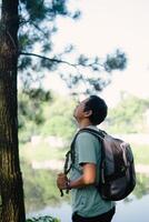 Man Taking a Deep Breath After Reaching a Beautiful Lake, fresh photo