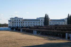 Historic Mansion Surrounded by Manicured Gardens on a Clear Day in Early Spring photo