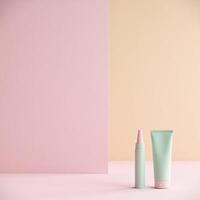 A tube of toothpaste and a tube of toothpaste on a pink and pastel background photo