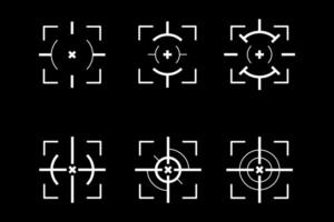 a set of four crosshairs on a black background vector