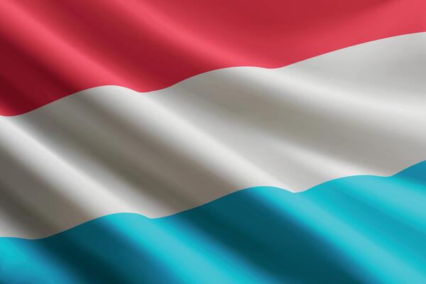 Luxembourg flag waving in the wind, detailed silk texture