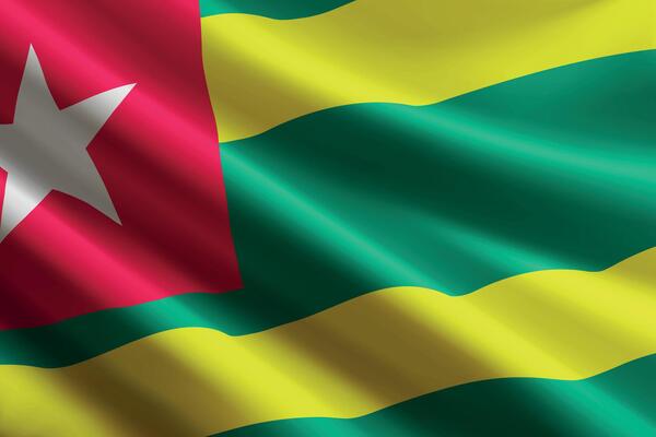 Togo flag waving in the wind, detailed silk texture