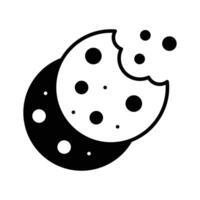 A glyph style icon of chocolate cookies. vector