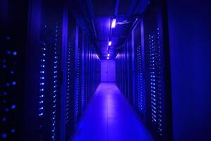 Server room illuminated by glowing blue lights and digital data streams photo