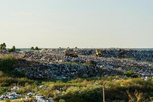 Environment pollution. A large accumulation of garbage. Garbage pile in trash dump or landfill photo