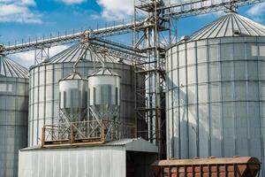 Elevator for wheat, corn, soy storage and grain. Import grains, wheat, corn, soy. Loading and transportation of agricultural products by railway. Agribusiness photo