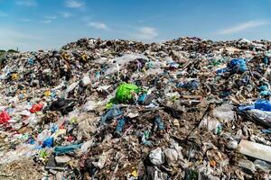 Garbage pile in trash dump or landfill. Environmental pollution photo