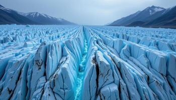 a glacier with deep cracks and glowing blue ice photo