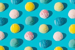 Colorful ice cream pattern on pastel light blue background. Summer food concept. Minimal isometric layout. Ice cream scoop aesthetic idea. photo