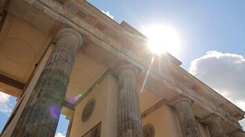Berlin Germany 25.05.2025, Sunlight Illuminates Massive Columns Of Brandenburg Gate From Below, Emphasizing Neoclassical Design And Architectural Grandeur video