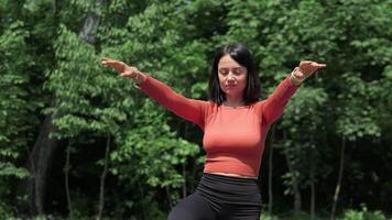 Woman Practicing Mindful Breathing In Park With Eyes Closed And Arms Outstretched, Embracing Nature And Inner Calm On A Bright Sunny Day video