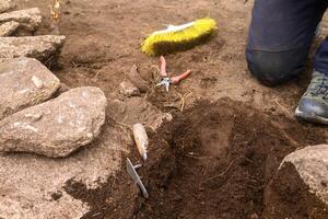 Archaeology in Action Fieldwork Scene with Tools for Discovery photo