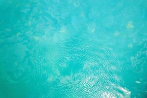 light and ripples distorting swimming pool tiles abstract pattern of turquoise water ripples photo