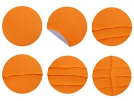 Set collection of blank orange paper stickers mock up in round shape isolated on white background photo
