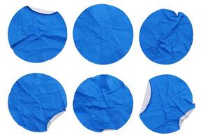 Set collection of blank crumpled blue paper stickers in round shape isolated on white background photo