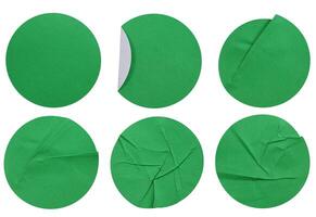 Set collection of blank green paper stickers mock up in round shape isolated on white background photo
