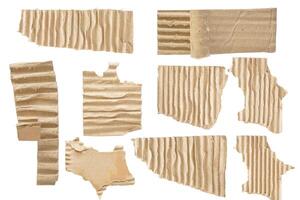 Set collection of brown torn pieces of corrugated cardboard paper isolated on white background for copy space text photo