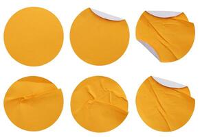 Set collection of blank yellow paper stickers mock up in round shape isolated on white background photo