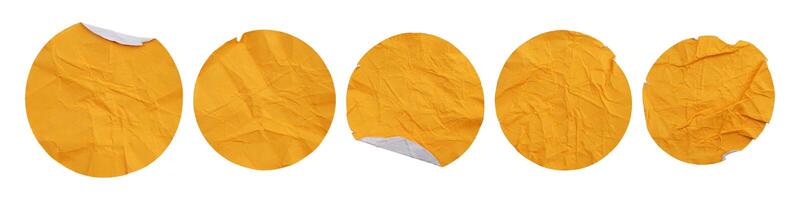 Set collection of blank crumpled yellow paper stickers in round shape isolated on white background photo
