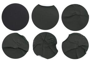 Set collection of blank black paper stickers mock up in round shape isolated on white background photo