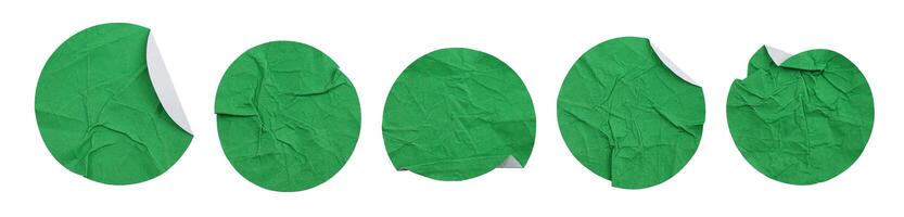 Set collection of blank crumpled green paper stickers in round shape isolated on white background photo