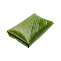 A single parcel of food wrapped in a fresh green banana leaf isolated png