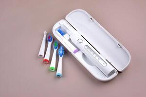 The Modern electric ultrasonic toothbrush with rechargeable battery photo