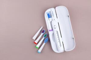 The modern electric ultrasonic toothbrush with rechargeable battery. photo