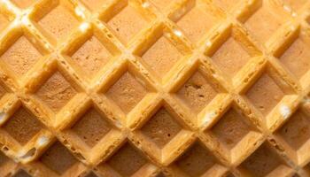 macro close-up of waffle cone grid texture with crispy golden pattern, dessert background for ice cream design photo
