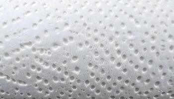 close up of white paper towel surface with absorbent dotted texture for moisture and kitchen cleaning background photo