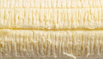 macro close-up texture of peeled banana surface with fibrous soft fruit pattern and natural light details for food background or organic texture photo