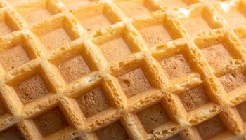 macro close-up of waffle cone surface with crispy golden grid pattern for dessert background or ice cream design photo