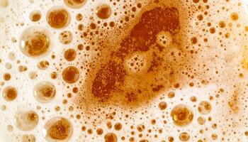 closeup macro texture of beer foam and bubbles with abstract frothy golden pattern, top view of carbonated drink surface photo