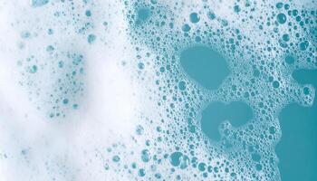 clean soap foam bubbles floating on light blue water surface, top view abstract hygiene texture for cleaning and freshness concept photo
