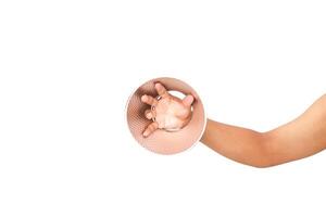 Hand holding patterned disc demonstrating perspective and interaction with object photo
