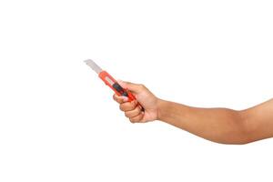 Studio shot of a hand holding a box cutter, isolated against a white background, sharp equipment photo