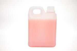 Pink Liquid in Plastic Container on White Background Ready for Usage at Home or Business photo