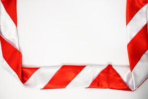 Red and White Striped Fabric Frame on White Background with Copy Space, Ideal for Design Projects photo