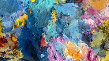 Vivid oil paint strokes in close-up. Bright colors and thick texture create an expressive, artistic abstract background. Perfect for creative projects and artistic concepts photo