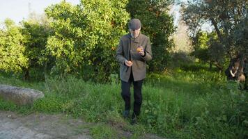 Man Smells Freshly Picked Mandarins While Walking Down the Street video