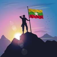 Myanmar flag raised on mountain peak with purplish yellow sunset background vector