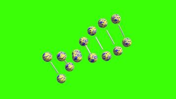 Colorful spheres arranged in a pattern on a vibrant green background showcase creativity and design video