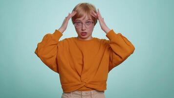 No idea, I dont know answer. Puzzled clueless uncertain attractive woman raising hands in helpless gesture, embarrassed confused by difficult question. Confused one girl on blue studio background video