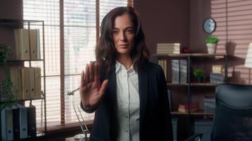 Caucasian woman female dissatisfied girl businesswoman business negative waving shaking head hand gesture showing stop prohibit refuse answer no rejection office indoors disagreement deny never not video